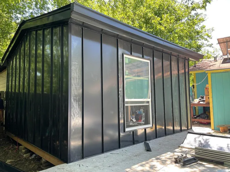 Black standing seam metal wall panels for Roof Inspection in South Riding